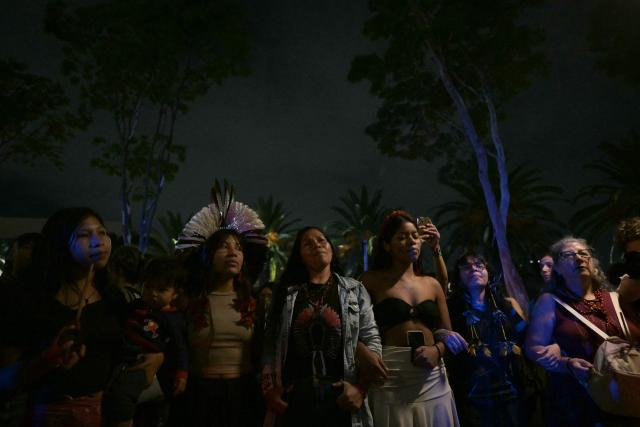Brazilian natives from the Guarani ethnic group and environmental activists protest against dredging in the Amazon in front of the headquarters of US agribusiness giant Cargill in Sao Paulo, Brazil, on February 20, 2026. (Photo by NELSON ALMEIDA / AFP)