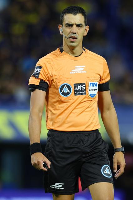 Referee Leandro Rey looks on during the Argentine Professional Football League 2026 Apertura Tournament match between Boca Juniors and Racing at La Bombonera Stadium in Buenos Aires on February 20, 2026. (Photo by ALEJANDRO PAGNI / AFP)