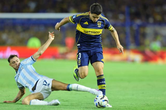 Racing's forward #17 Tomas Conechny and Boca Juniors' defender #03 Lautaro Blanco fight for the ball during the Argentine Professional Football League 2026 Apertura Tournament match between Boca Juniors and Racing at La Bombonera Stadium in Buenos Aires on February 20, 2026. (Photo by Alejandro PAGNI / AFP)