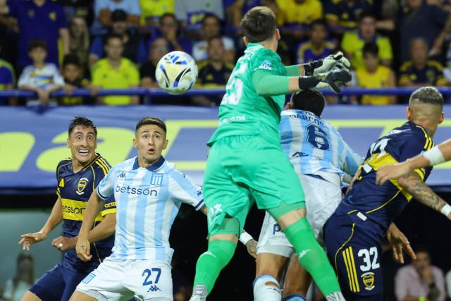 Racing's defender #27 Gabriel Rojas (2nd L)looks at the ball during the Argentine Professional Football League 2026 Apertura Tournament match between Boca Juniors and Racing at La Bombonera Stadium in Buenos Aires on February 20, 2026. (Photo by Alejandro PAGNI / AFP)