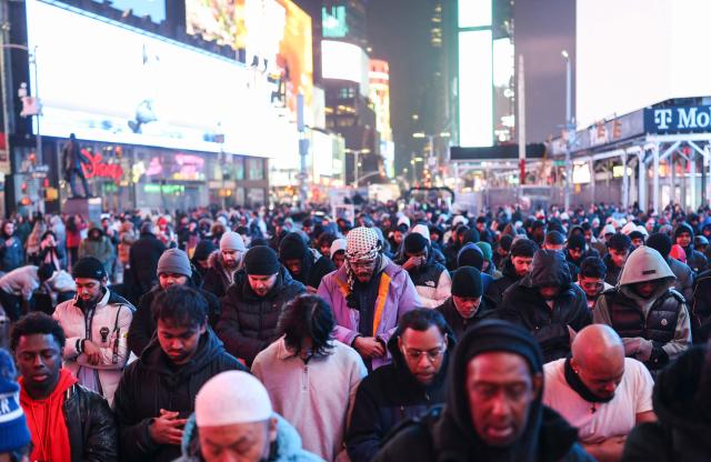 Members of the Muslim community take part in a Taraweeh prayer during Ramadan in Times Square on February 20, 2026 in New York City. (Photo by ANGELA WEISS / AFP)