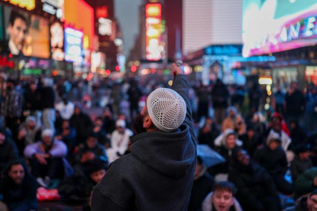 Members of the Muslim community take part in a Taraweeh prayer during Ramadan in Times Square on February 20, 2026 in New York City. (Photo by ANGELA WEISS / AFP)