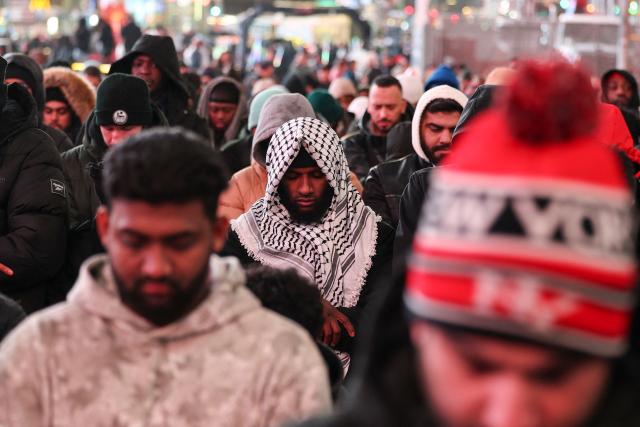 Members of the Muslim community take part in a Taraweeh prayer during Ramadan in Times Square on February 20, 2026 in New York City. (Photo by ANGELA WEISS / AFP)