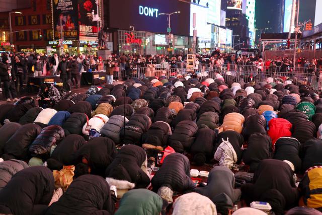 Members of the Muslim community take part in a Taraweeh prayer during Ramadan in Times Square on February 20, 2026 in New York City. (Photo by ANGELA WEISS / AFP)