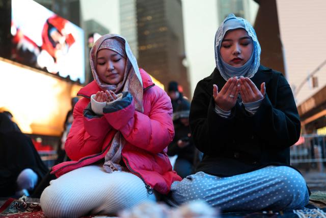 Members of the Muslim community take part in a Taraweeh prayer during Ramadan in Times Square on February 20, 2026 in New York City. (Photo by ANGELA WEISS / AFP)