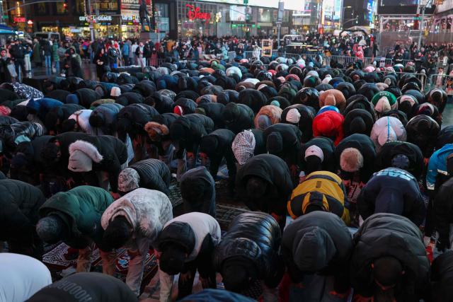 Members of the Muslim community take part in a Taraweeh prayer during Ramadan in Times Square on February 20, 2026 in New York City. (Photo by ANGELA WEISS / AFP)
