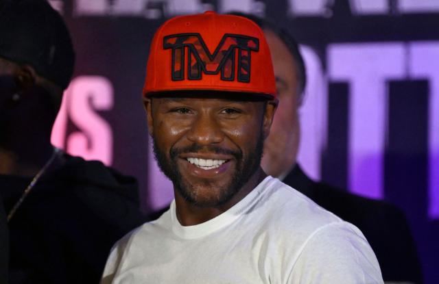 (FILES) US boxer Floyd Mayweather Jr. smiles during the weighing ceremony for his upcoming exhibition fight against John Gutti III in Mexico City on August 23, 2024. Floyd Mayweather is coming out of retirement and will return to professional boxing after his exhibition fight with Mike Tyson this spring, he announced on February 20. Former multi-weight world champion Mayweather retired from boxing in 2017, unbeaten in 50 bouts, though he has appeared in several exhibition fights since. (Photo by ALFREDO ESTRELLA / AFP)