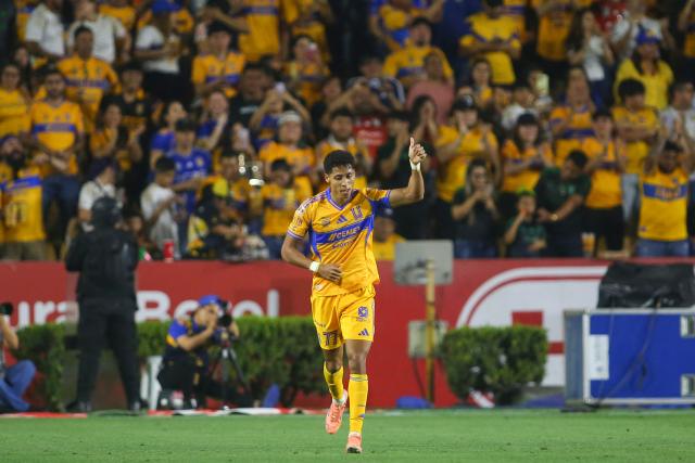Tigres' forward #77 Ozziel Herrera celebrates after scoring his team's first goal during the Liga MX Clausura football match between Tigres and Pachuca at the University Stadium (UANL) in Monterrey, Mexico, on February 20, 2026. (Photo by Julio Cesar AGUILAR / AFP)