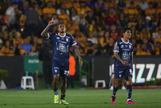 Pachuca's Brazilian forward #29 Kenedy (L) celebrates scoring his team's second goal during the Liga MX Clausura football match between Tigres and Pachuca at the University Stadium (UANL) in Monterrey, Mexico, on February 20, 2026. (Photo by Julio Cesar AGUILAR / AFP)