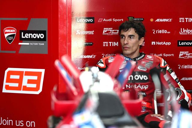 Ducati Lenovo Team's Spanish rider Marc Marquez sits in the garage during the first day of the 2026 MotoGP pre-season test at the Buriram International Circuit in Buriram on February 21, 2026. (Photo by Lillian SUWANRUMPHA / AFP)