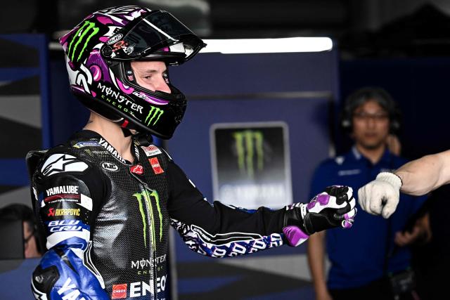 Monster Energy Yamaha's French rider Fabio Quatararo gestures in the garage during the first day of the 2026 MotoGP pre-season test at the Buriram International Circuit in Buriram on February 21, 2026. (Photo by Lillian SUWANRUMPHA / AFP)
