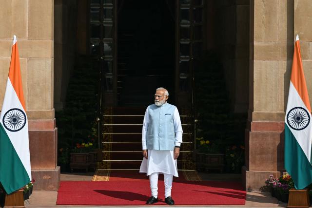 India's Prime Minister Narendra Modi waits for the arrival of Brazil's President Luiz Inacio Lula da Silva at the Hyderabad House in New Delhi on February 21, 2026. (Photo by Sajjad HUSSAIN / AFP)