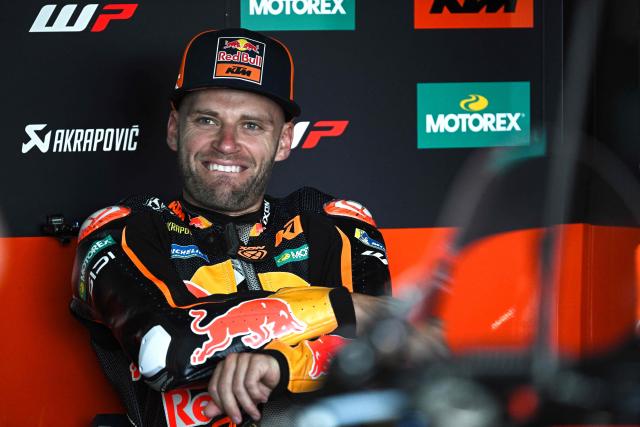 Red Bull KTM Factory Racing's South African rider Brad Binder sits in the garage during the first day of the 2026 MotoGP pre-season test at the Buriram International Circuit in Buriram on February 21, 2026. (Photo by Lillian SUWANRUMPHA / AFP)