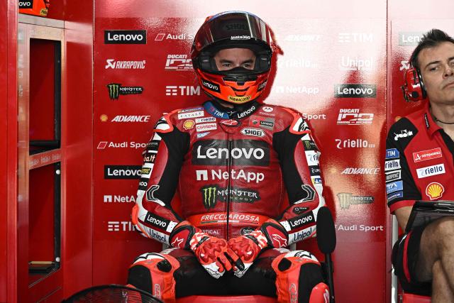 Ducati Lenovo Team's Spanish rider Marc Marquez sits in the garage during the first day of the 2026 MotoGP pre-season test at the Buriram International Circuit in Buriram on February 21, 2026. (Photo by Lillian SUWANRUMPHA / AFP)