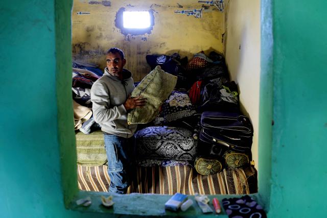 A man inspects damage in one of the houses affected by floods that struck northern and western Morocco, in the Kenitra region on February 20, 2026. (Photo by Abdel Majid BZIOUAT / AFP)