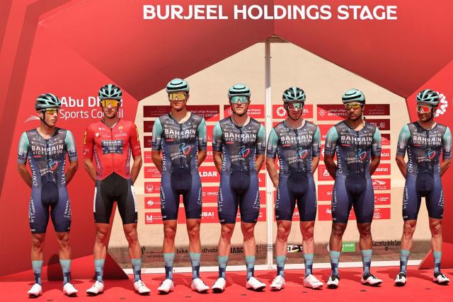 Bahrain Victorious' riders pose on stage before the sixth stage of the UAE Tour cycling event from al-Ain Museum to Jebel Hafeet in Abu Dhabi on February 21, 2026. (Photo by Fadel SENNA / AFP)