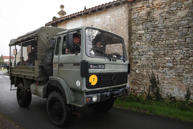 An elevated vehicle of the French gendarmerie drives while taking part 
in a rescue operation to evacutate isolated residents in Courcoury, south-western France on February 21, 2026.. Météo-France has extended flood alerts for February 18 and February 19, 2026 : red for Loire-Atlantique, Charente-Maritime and Maine-et-Loire, and orange in nine other departments in the west, while noting that the dry weather should help the waters recede. (Photo by ROMAIN PERROCHEAU / AFP)