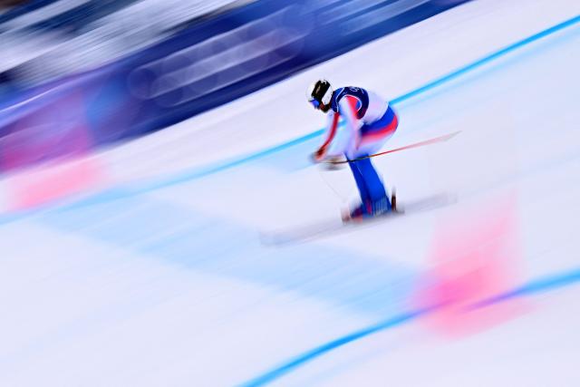 France's Evan Klufts competes in the freestyle skiing men's ski cross seeding during the Milano Cortina 2026 Winter Olympic Games at Livigno Snow Park, in Livigno (Valtellina), on February 21, 2026. (Photo by Kirill KUDRYAVTSEV / AFP)