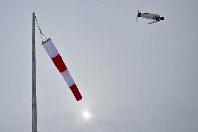 Canada's Marion Thenault competes in the freestyle skiing mixed team aerials final 1 during the Milano Cortina 2026 Winter Olympic Games at Livigno Aerials & Moguls Park, in Livigno (Valtellina), on February 21, 2026. (Photo by Jeff PACHOUD / AFP)