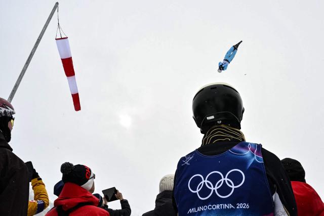 Kazakhstan's Roman Ivanov competes in the freestyle skiing mixed team aerials final 1 during the Milano Cortina 2026 Winter Olympic Games at Livigno Aerials & Moguls Park, in Livigno (Valtellina), on February 21, 2026. (Photo by Jeff PACHOUD / AFP)