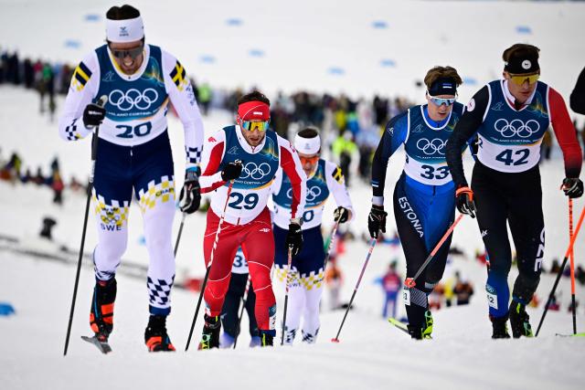 (From L) Sweden's Calle Halfvarsson, Poland's Dominik Bury, Estonia's Martin Himma and Czech Republic's Mike Ophoff compete during the men's cross country 50km mass start final event of the Milano Cortina 2026 Winter Olympic Games at Tesero Cross-Country Skiing Stadium in Lago di Tesero (Val di Fiemme) on February 21, 2026. (Photo by Tobias SCHWARZ / AFP)
