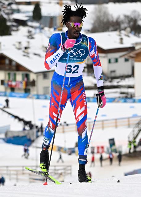 Haiti's Stevenson Savart competes during the men's cross country 50km mass start final event of the Milano Cortina 2026 Winter Olympic Games at Tesero Cross-Country Skiing Stadium in Lago di Tesero (Val di Fiemme) on February 21, 2026. (Photo by Tobias SCHWARZ / AFP)