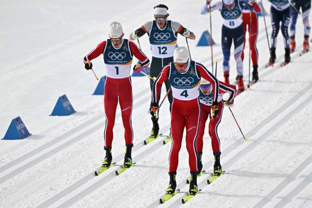 (From L) Norway's Johannes Hoesflot Klaebo, Individual Neutral Athlete Savelii Korostelev, Norway's Emil Iversen and Norway's Martin Loewstroem Nyenget compete during the men's cross country 50km mass start final event of the Milano Cortina 2026 Winter Olympic Games at Tesero Cross-Country Skiing Stadium in Lago di Tesero (Val di Fiemme) on February 21, 2026. (Photo by Javier SORIANO / AFP)