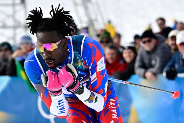 Haiti's Stevenson Savart competes during the men's cross country 50km mass start final event of the Milano Cortina 2026 Winter Olympic Games at Tesero Cross-Country Skiing Stadium in Lago di Tesero (Val di Fiemme) on February 21, 2026. (Photo by Tobias SCHWARZ / AFP)
