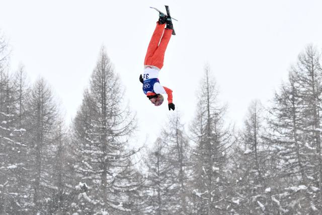 Switzerland's Pirmin Werner competes in the freestyle skiing mixed team aerials final 2 during the Milano Cortina 2026 Winter Olympic Games at Livigno Aerials & Moguls Park, in Livigno (Valtellina), on February 21, 2026. (Photo by Jeff PACHOUD / AFP)