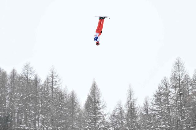Switzerland's Pirmin Werner competes in the freestyle skiing mixed team aerials final 2 during the Milano Cortina 2026 Winter Olympic Games at Livigno Aerials & Moguls Park, in Livigno (Valtellina), on February 21, 2026. (Photo by Jeff PACHOUD / AFP)