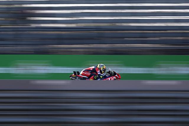 Honda HRC Castrol's Spanish rider Joan Mir rides on the track during the first day of the 2026 MotoGP pre-season test at the Buriram International Circuit in Buriram on February 21, 2026. (Photo by Lillian SUWANRUMPHA / AFP)