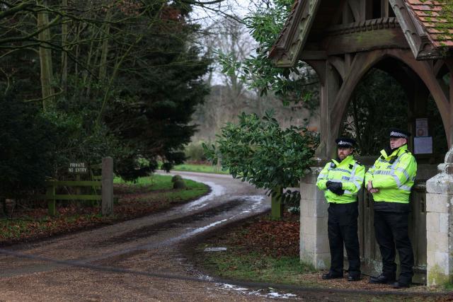 Police stand guard at an entrance to Wood Farm on the royal family's Sandringham Estate in Norfolk, eastern England on February 21, 2026, after Britain's former prince Andrew was arrested on February 19. The British government on February 20 mulled passing a law to remove former prince Andrew from the line of succession, as police stepped up investigations into his conduct, quizzing the disgraced royal's former protection officers. (Photo by Toby Shepheard / AFP)
