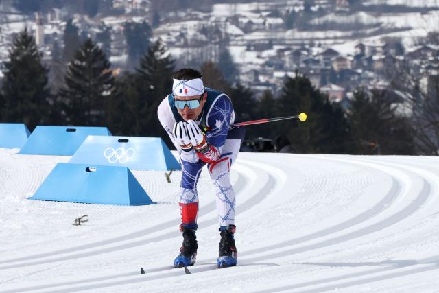 France's Theo Schely competes during the men's cross country 50km mass start final event of the Milano Cortina 2026 Winter Olympic Games at Tesero Cross-Country Skiing Stadium in Lago di Tesero (Val di Fiemme) on February 21, 2026. (Photo by Anne-Christine POUJOULAT / AFP)