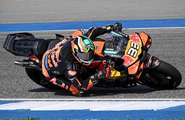 Red Bull KTM Factory Racing's South African rider Brad Binder rides on the track during the first day of the 2026 MotoGP pre-season test at the Buriram International Circuit in Buriram on February 21, 2026. (Photo by Lillian SUWANRUMPHA / AFP)