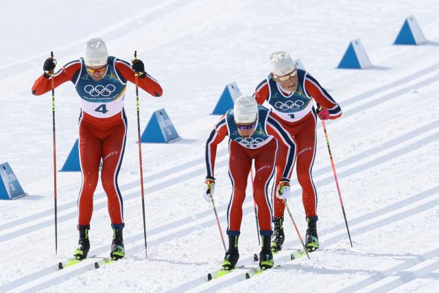 (From L) Norway's Emil Iversen, Norway's Martin Loewstroem Nyenget and Norway's Johannes Hoesflot Klaebo compete during the men's cross country 50km mass start final event of the Milano Cortina 2026 Winter Olympic Games at Tesero Cross-Country Skiing Stadium in Lago di Tesero (Val di Fiemme) on February 21, 2026. (Photo by Anne-Christine POUJOULAT / AFP)
