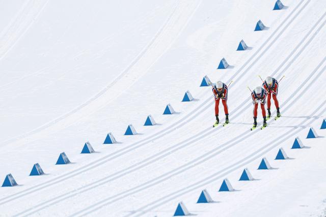 (From L) Norway's Emil Iversen, Norway's Martin Loewstroem Nyenget and Norway's Johannes Hoesflot Klaebo compete during the men's cross country 50km mass start final event of the Milano Cortina 2026 Winter Olympic Games at Tesero Cross-Country Skiing Stadium in Lago di Tesero (Val di Fiemme) on February 21, 2026. (Photo by Anne-Christine POUJOULAT / AFP)