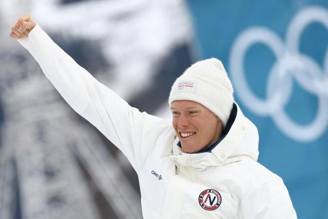 Silver medallist Norway's Martin Loewstroem Nyenget celebrates during a podium ceremony for the men's cross country 50km mass start final event of the Milano Cortina 2026 Winter Olympic Games at Tesero Cross-Country Skiing Stadium in Lago di Tesero (Val di Fiemme) on February 21, 2026. (Photo by Anne-Christine POUJOULAT / AFP)