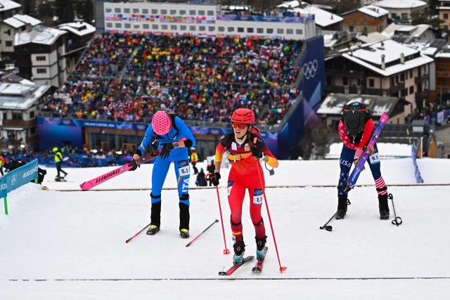 (From L) Italy's Alba De Silvestro, Spain's Ana Alonso Rodriguez and USA's Anna Gibson compete in the mixed relay ski mountaineering race during the Milano Cortina 2026 Winter Olympic Games at the Stelvio Ski Centre in Bormio (Valtellina) on February 21, 2026. (Photo by Fabrice COFFRINI / AFP)