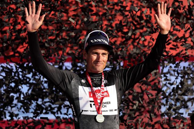 Alpecin-Premier Tech's Swiss rider Silvan Dillier celebrates on the podium after winning the black jersey in the sixth stage of the UAE Tour cycling event from al-Ain Museum to Jebel Hafeet in Abu Dhabi on February 21, 2026. (Photo by Fadel SENNA / AFP)