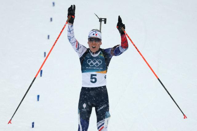 France's Oceane Michelon reacts as she approaches the finish line during the women's biathlon 12.5km mass start event during the Milano Cortina 2026 Winter Olympic Games at the Anterselva Biathlon Arena (Sudtirol Arena) in Anterselva (Val Pusteria) on February 21, 2026. (Photo by Odd ANDERSEN / AFP)