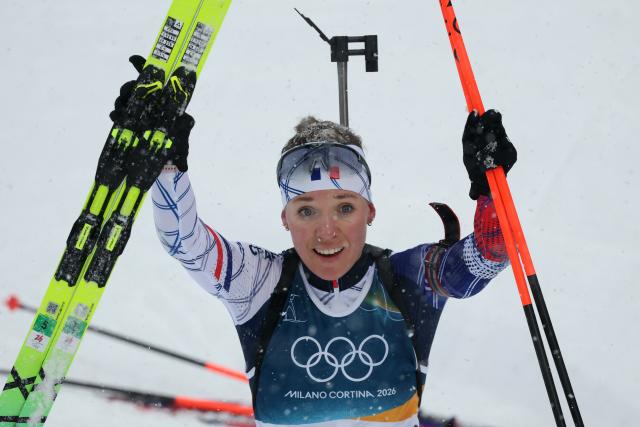 Gold medallist France's Oceane Michelon reacts after crossing the finish line during the women's biathlon 12.5km mass start event during the Milano Cortina 2026 Winter Olympic Games at the Anterselva Biathlon Arena (Sudtirol Arena) in Anterselva (Val Pusteria) on February 21, 2026. (Photo by Odd ANDERSEN / AFP)