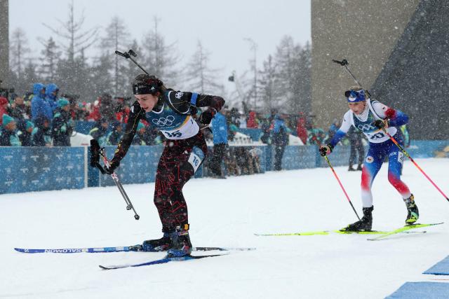 Germany's Vanessa Voigt and Czech Republic's Tereza Vobornikova leave the shooting range as they compete in the women's biathlon 12.5km mass start event during the Milano Cortina 2026 Winter Olympic Games at the Anterselva Biathlon Arena (Sudtirol Arena) in Anterselva (Val Pusteria) on February 21, 2026. (Photo by Odd ANDERSEN / AFP)