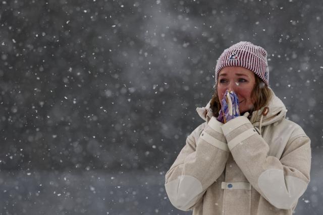 Gold medallist France's Oceane Michelon reacts on the podium of the women's biathlon 12.5km mass start event during the Milano Cortina 2026 Winter Olympic Games at the Anterselva Biathlon Arena (Sudtirol Arena) in Anterselva (Val Pusteria) on February 21, 2026. (Photo by FRANCK FIFE / AFP)