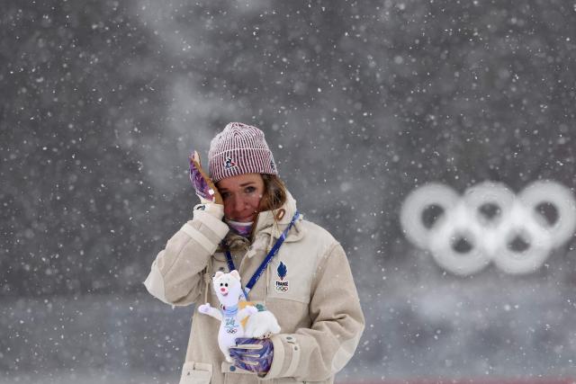 Gold medallist France's Oceane Michelon reacts on the podium of the women's biathlon 12.5km mass start event during the Milano Cortina 2026 Winter Olympic Games at the Anterselva Biathlon Arena (Sudtirol Arena) in Anterselva (Val Pusteria) on February 21, 2026. (Photo by FRANCK FIFE / AFP)