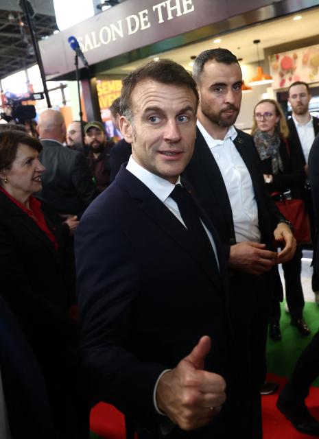France's President Emmanuel Macron makes a thumbs up during the opening day of the International Agricultural Show (Salon de l'Agriculture) at Paris Expo Porte de Versailles in Paris on February 21, 2026. (Photo by Christophe PETIT TESSON / POOL / AFP)