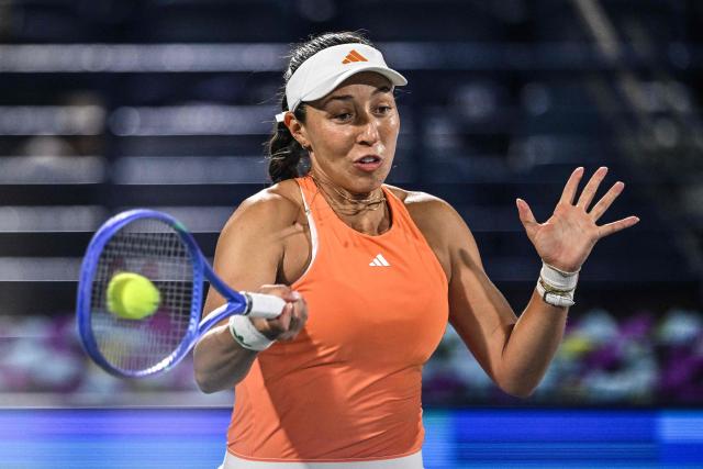US player Jessica Pegula hits a return to Ukraine's Elina Svitolina during their women’s singles final match at the Dubai Duty Free Tennis tournament in Dubai on February 21, 2026. (Photo by Ryan Lim / AFP)