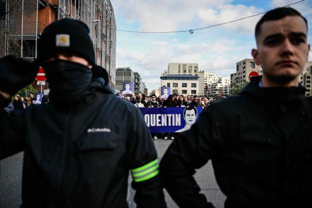Protesters attend a march in tribute to far-right activist Quentin Deranque, who died after being attacked on the sidelines of a far-right protest against a La France Insoumise (LFI) event at Sciences Po Lyon, in Lyon on February 21, 2026. (Photo by OLIVIER CHASSIGNOLE / AFP)
