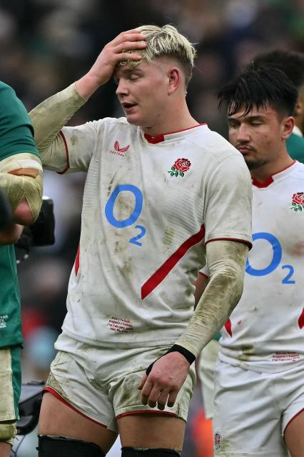 England's number 8 Henry Pollock (C) reacts at the end of their loss in the Six Nations international rugby union match between England and Ireland at Allianz Stadium, Twickenham, in south-west London, on February 21, 2026. (Photo by Glyn KIRK / AFP)