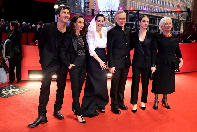 German director Ilker Catak (L) and the crew of the movie "Gelbe Briefe" (Yellow Letters) arrive on the red carpet for the Award Ceremony of the 76th Berlinale, Europe's first major film festival of the year, in Berlin on February 21, 2026. The 76th Berlin Film Festival draws to a close after 10 days, with 22 films in competition. (Photo by John MACDOUGALL / AFP)