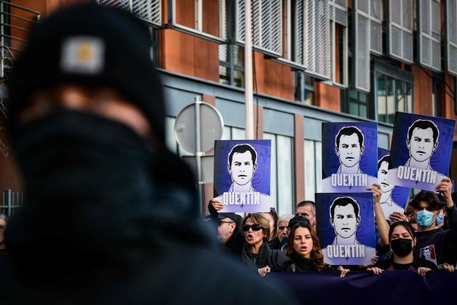 Protesters hold portraits of far-right activist Quentin Deranque during a march in tribute to Quentin Deranque, who died after being attacked on the sidelines of a far-right protest against a La France Insoumise (LFI) event at Sciences Po Lyon, in Lyon on February 21, 2026. (Photo by OLIVIER CHASSIGNOLE / AFP)